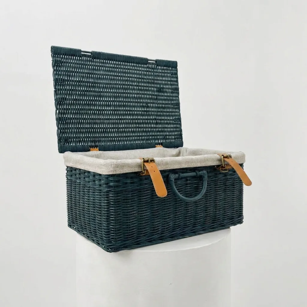 Dark teal rattan storage box with cream lining and leather handles