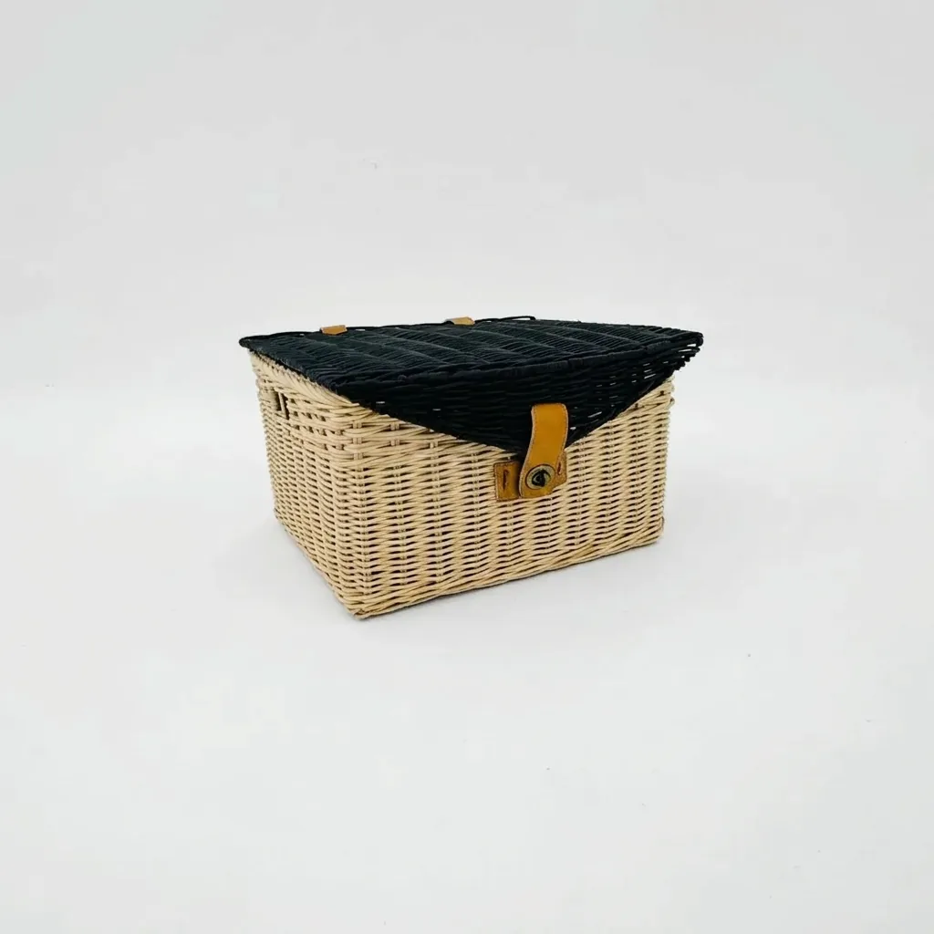 Natural rattan storage box with a brass clasp closure